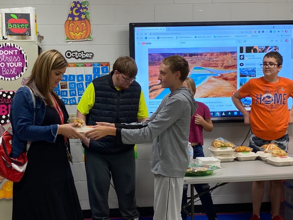 people handing food